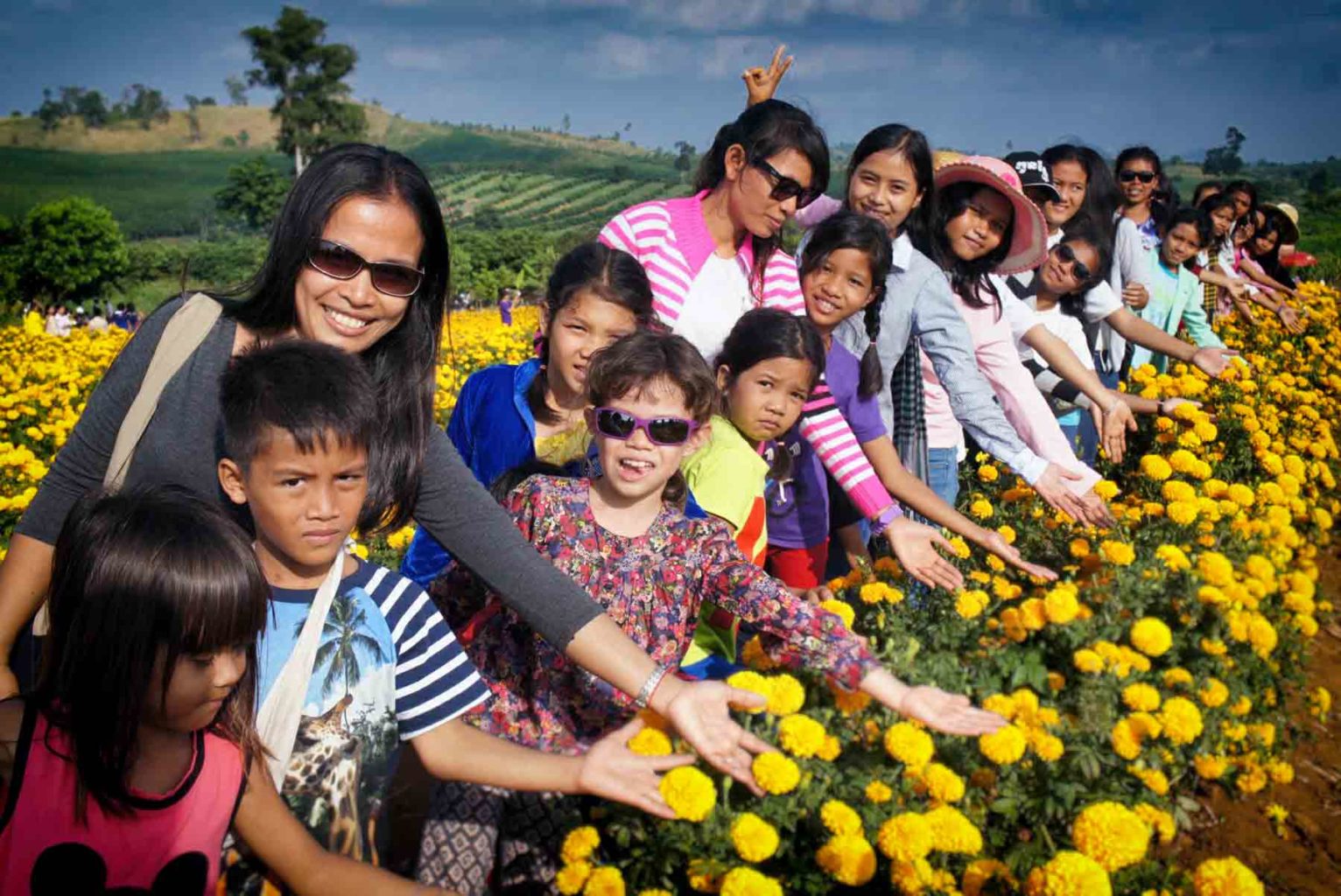 Children from the shelter on an outing with Theavy Bun the president of the NGO AVEC in Cambodia.