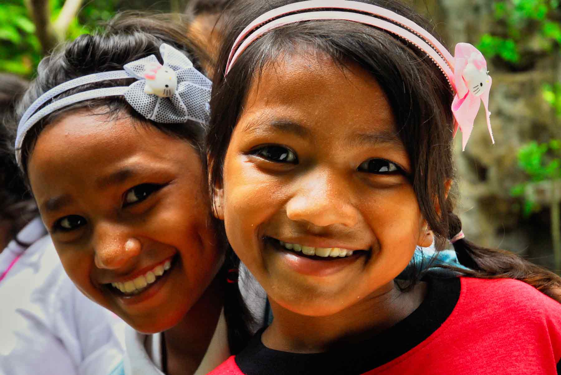 Two young orphan girls playing in our child protection centre in Cambodia.
